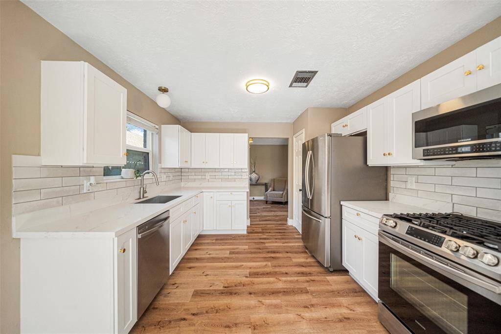 The kitchen is the centerpiece of the home, ideal for culinary creations and gathering with loved ones.
