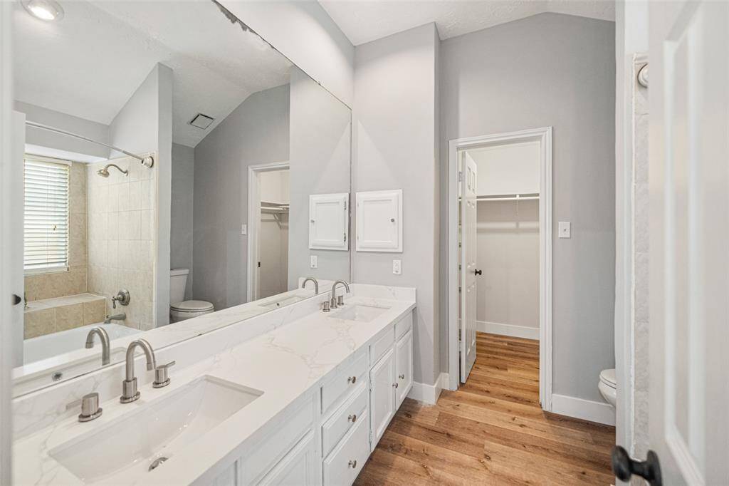 Timeless Main Bathroom: Modernized and refreshed offering immediate comfort with room to personalize further if desired.