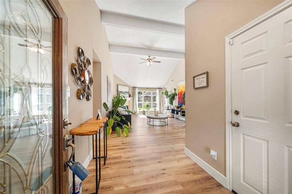 A bright and welcoming entryway sets the tone with an immediate sense of care and meticulous updates.