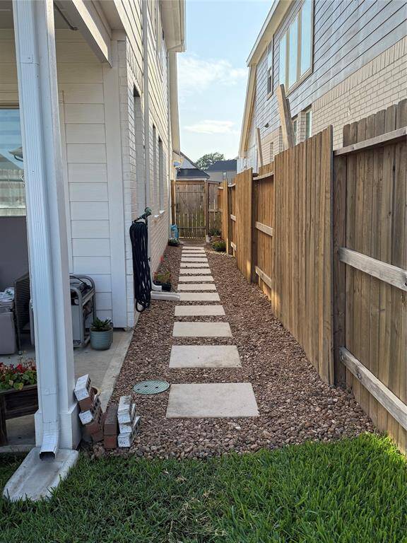 sides of house has rocks and pavers.  Gutters all the way around.