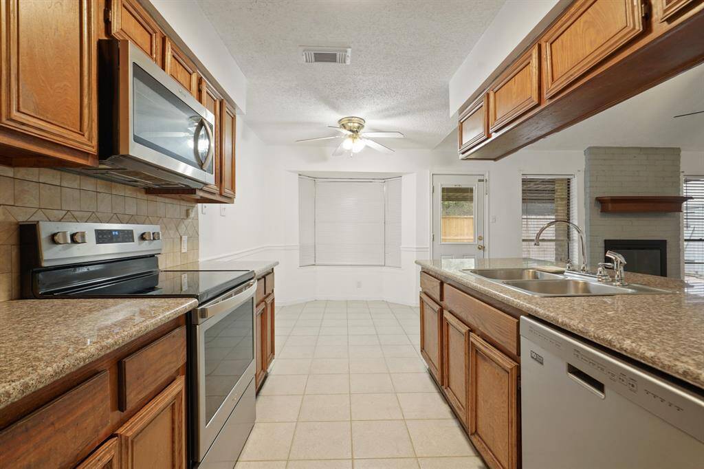 Kitchen with electric oven and range