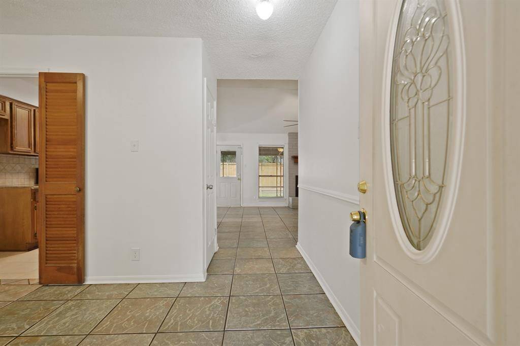 As you walk through the front door to the left there is a dining/ flex space that leads into the kitchen