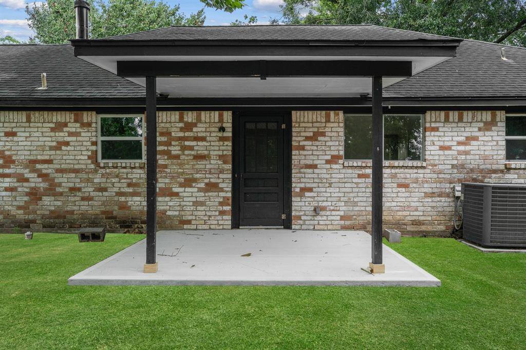 Relax on the freshly poured patio, a perfect place to gather with friends, share converstaion, and enjoy peaceful outdoor moments. Virtually staged grass.