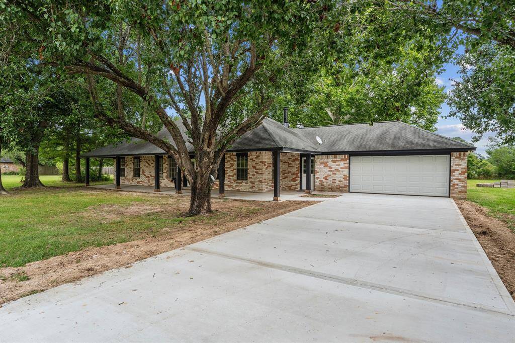 As you pull into the driveway, you're greeted by the shade and charm of beautiful, mature trees-setting the perfect scene for this inviting property.