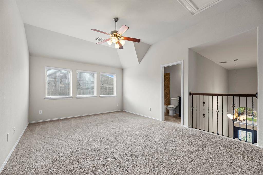 Upstairs, features a game room along with secondary bedrooms, providing plenty of space for family and guests.