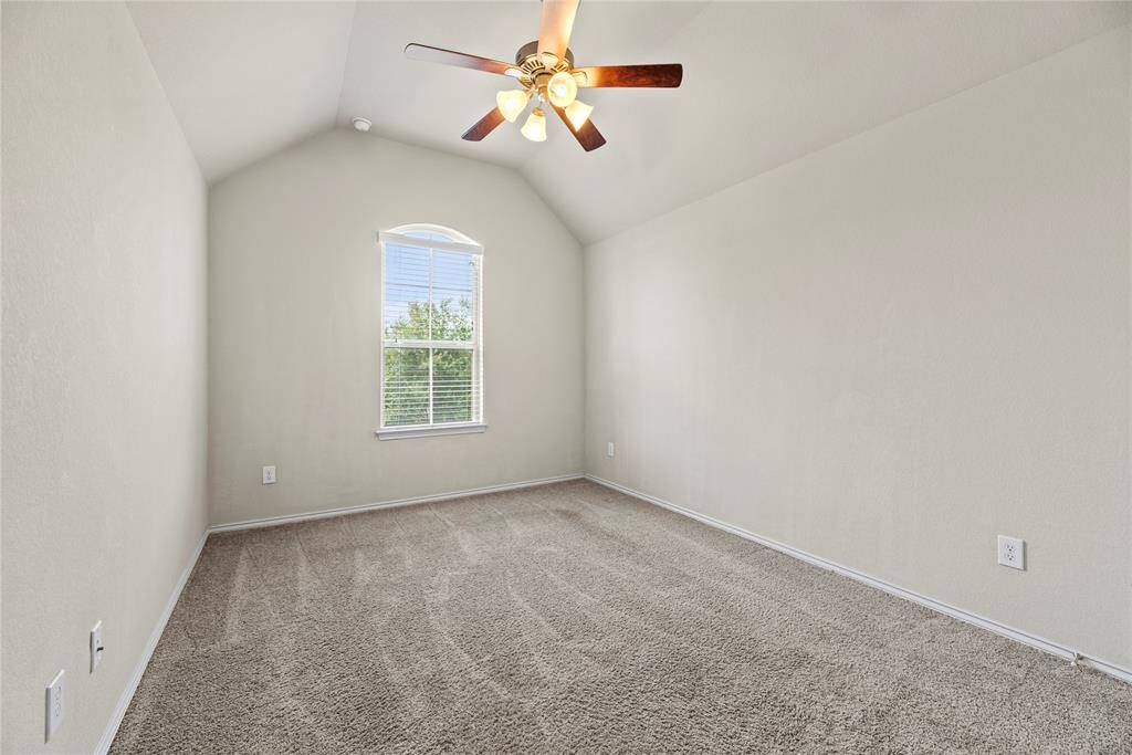 Upstairs: Secondary bedroom with en-suite bathroom.