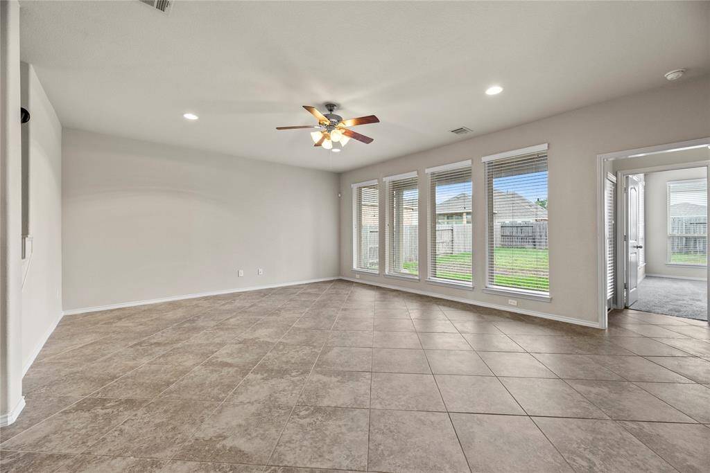 Family room seamlessly merges with the kitchen and breakfast area.