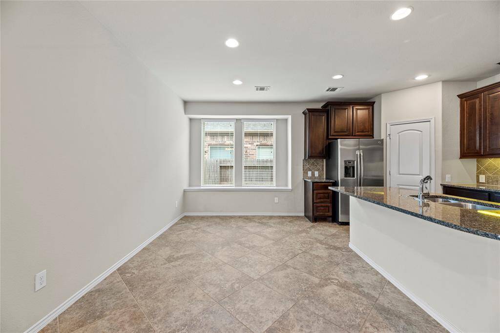 View of breakfast area.  A walk-in pantry offers ample storage space, ensuring everything is conveniently within reach.