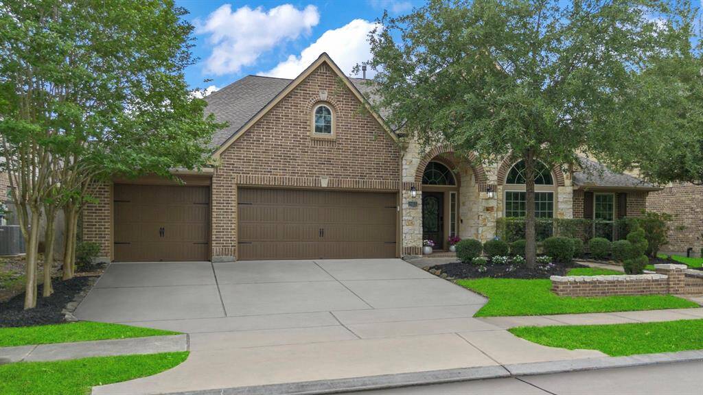 The home features a stone and brick exterior, offering timeless curb appeal and durable craftsmanship. Enjoy added privacy with no front neighbors!