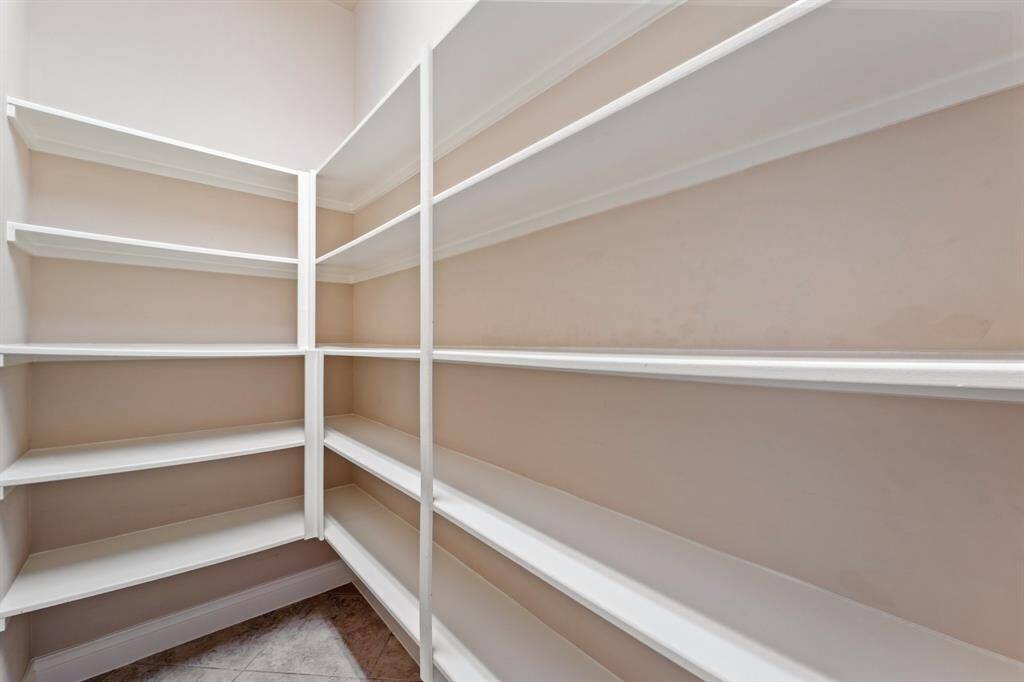 The kitchen features a large pantry, offering generous storage space for all your cooking essentials.Perfect for keeping your kitchen organized and clutter-free.