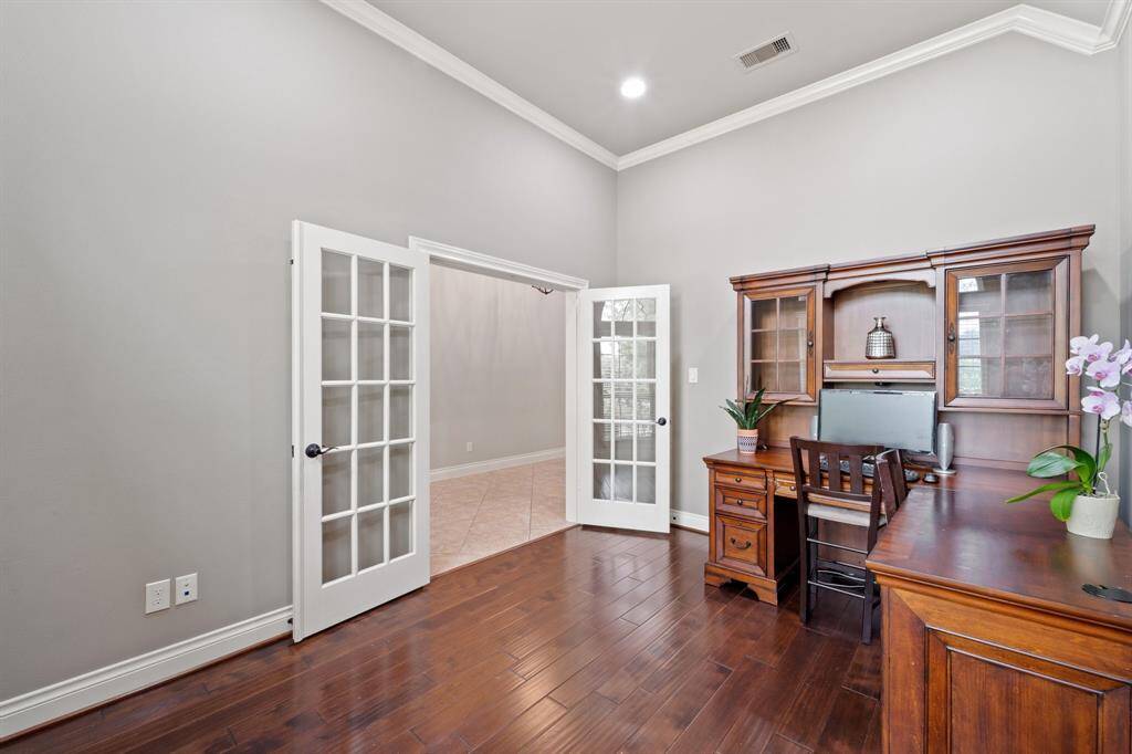 Glass doors add a touch of elegance while keeping the space open and connected.