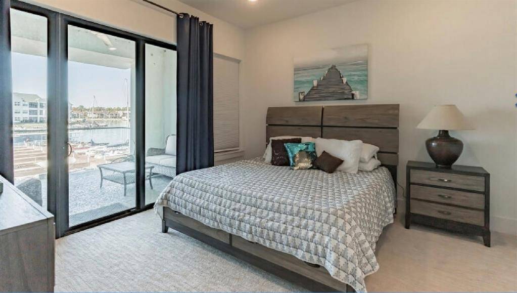 Primary bedroom with view of Lake and Patio!