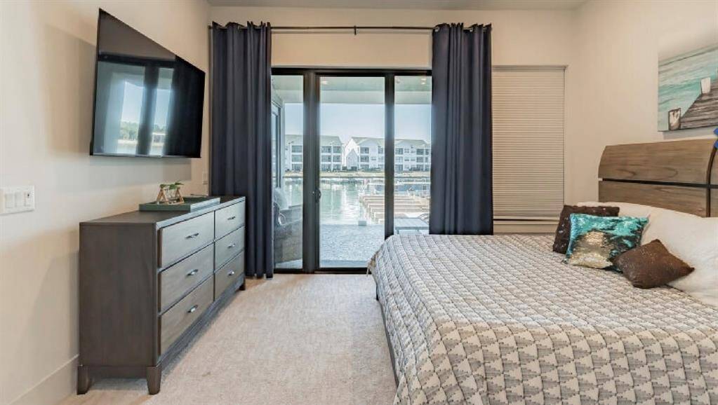 Primary Bedroom with smart TV and view of Lake!