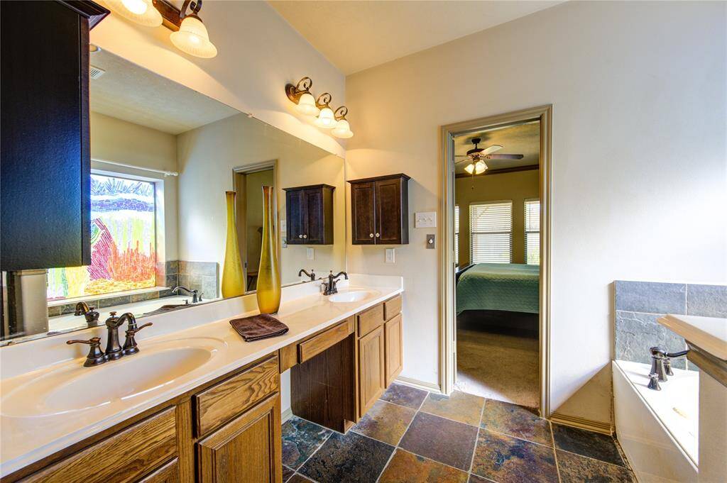 2 sinks in the primary bathroom natural light, separate tub/shower + a private water closet