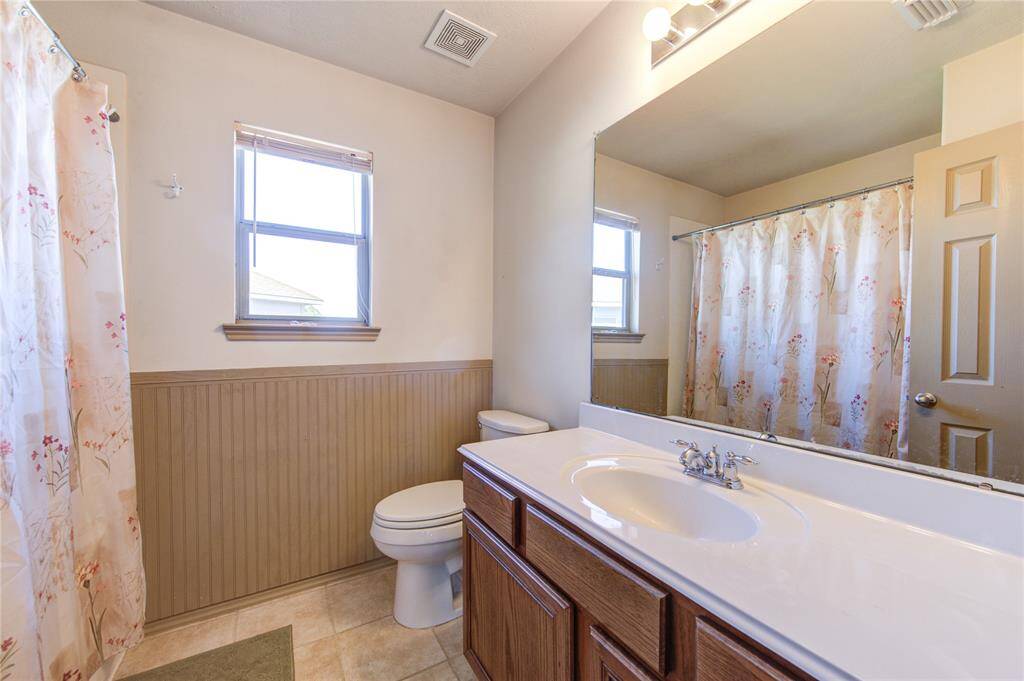 2nd story bathroom with natural light. There are 2.5 bathrooms in this home