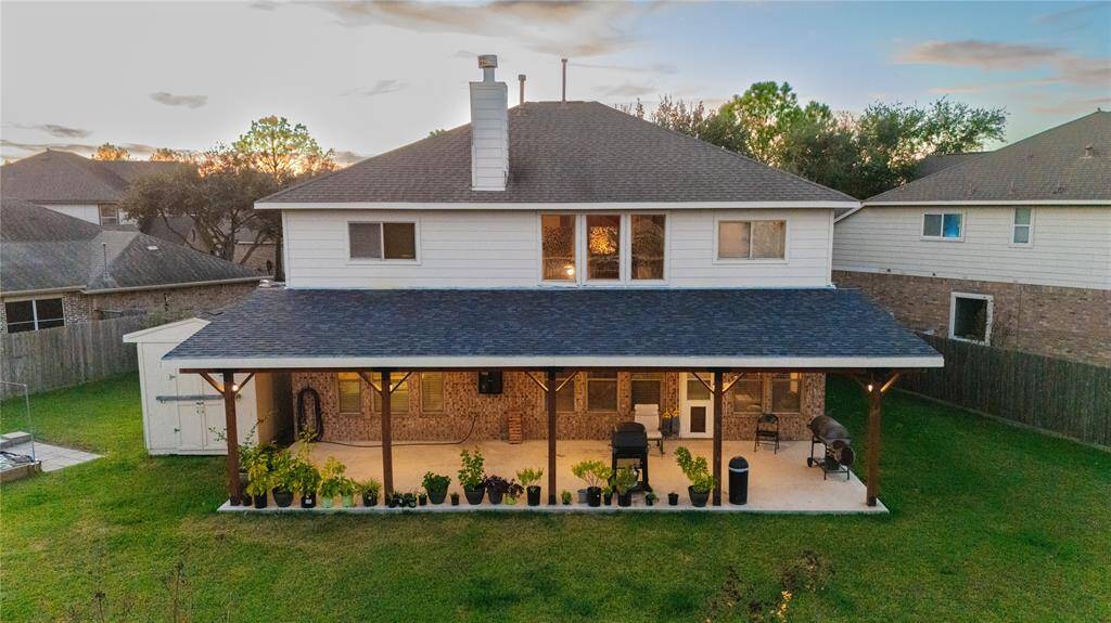 Oversized backyard with a custom 40 foot wide covered patio