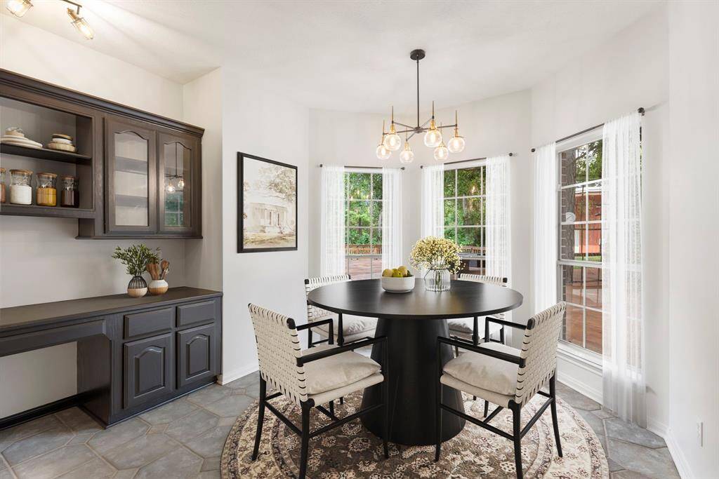 AI Staged Breakfast nook, open to the kitchen and living room