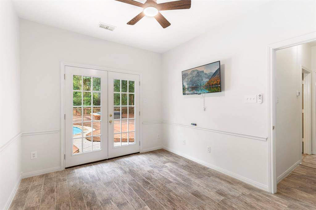 This versatile downstairs bedroom offers ideal space for guests or multi-family living, with potential for a home office or flex space.