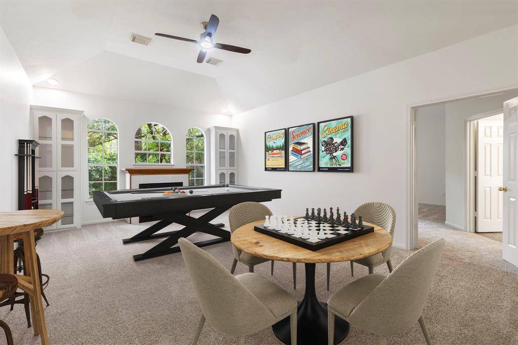 Spacious and versatile upstairs room perfect for a game area, family gatherings, or a home gym.