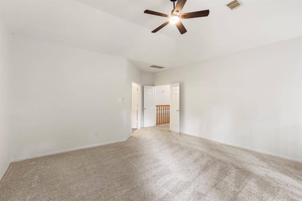 Expansive master bedroom offering ample space and natural light.