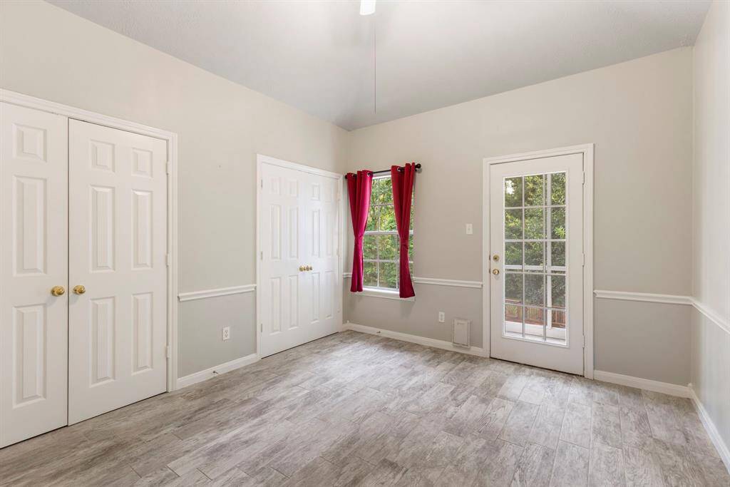 Fifth bedroom with private screened balcony for outdoor relaxation.