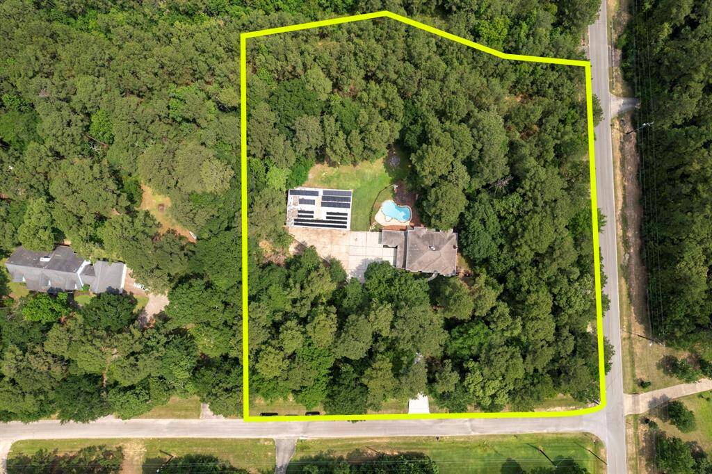 Spacious 3.2-acre corner lot offering ample privacy and endless possibilities.