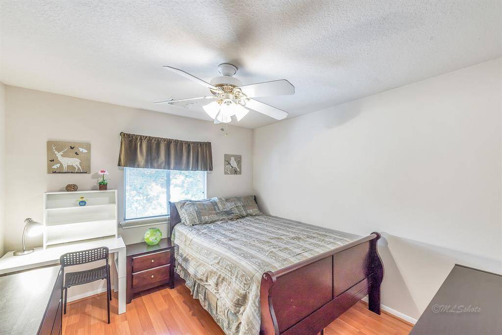 Secodary bedroom located upstairs. Queen-sized bed. This bedroom has views to the side of the home.