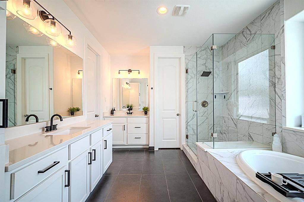 Spa retreat primary bath with soaker tub and walk-in shower