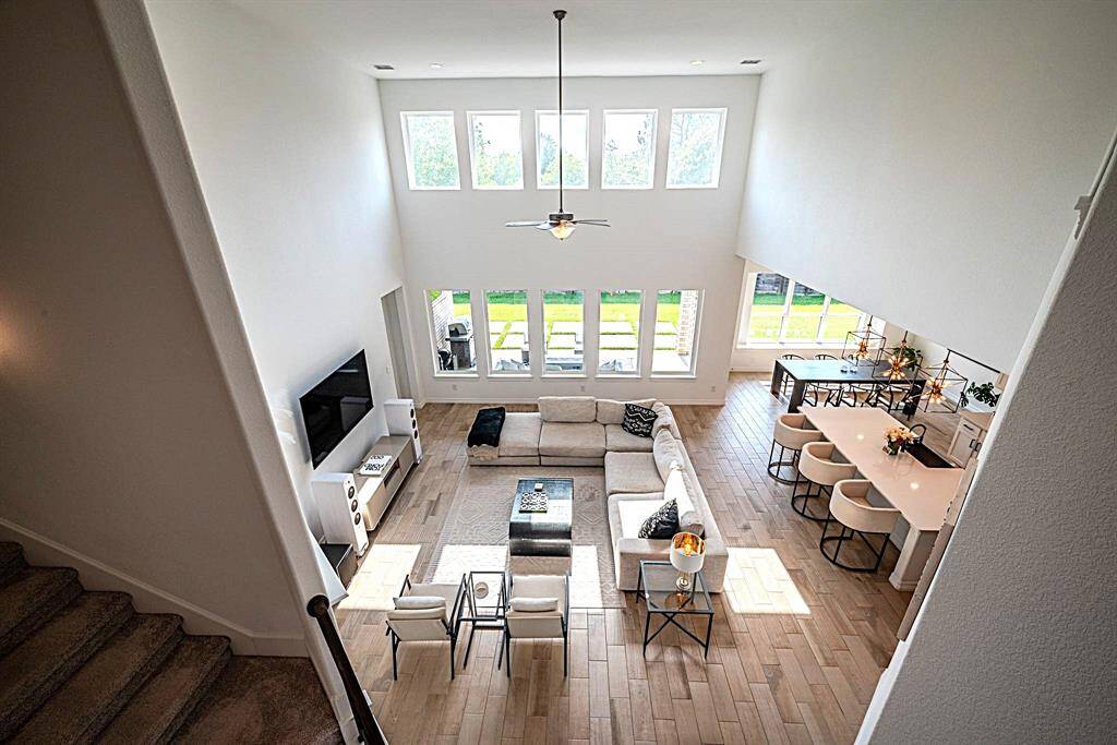 View of living room from catwalk to game room