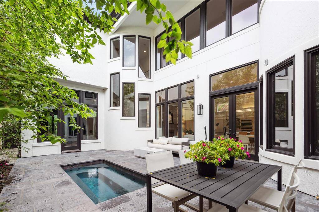 Outdoor features include a resurfaced pool, new pavers, and a gas valve ready for your future summer kitchen.