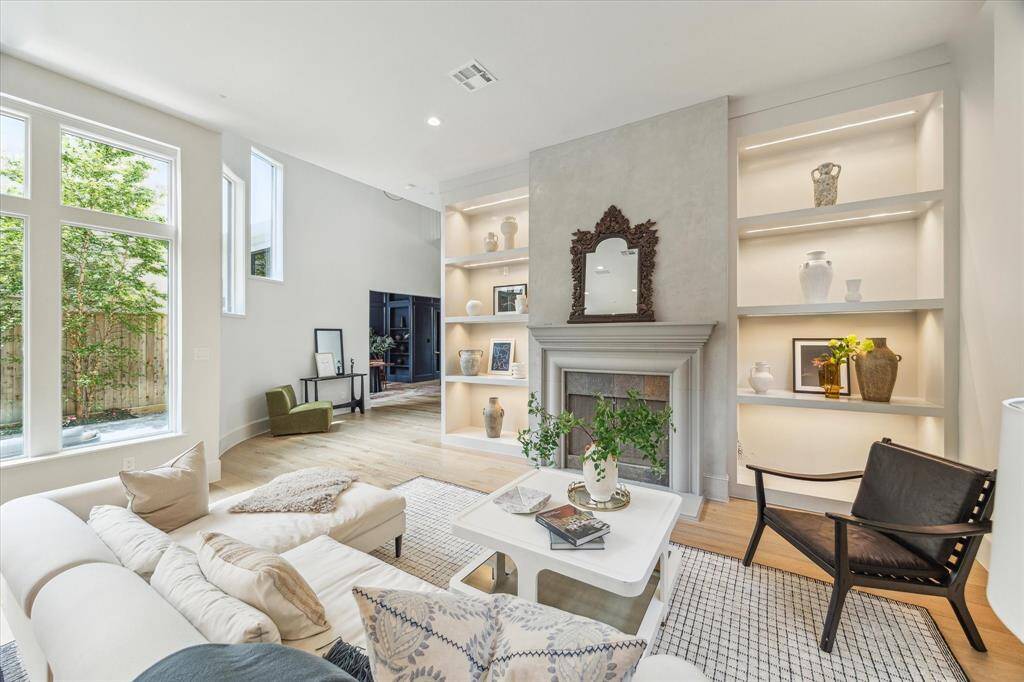 Gorgeous views, high ceilings, and clean lines define the open-concept living room.