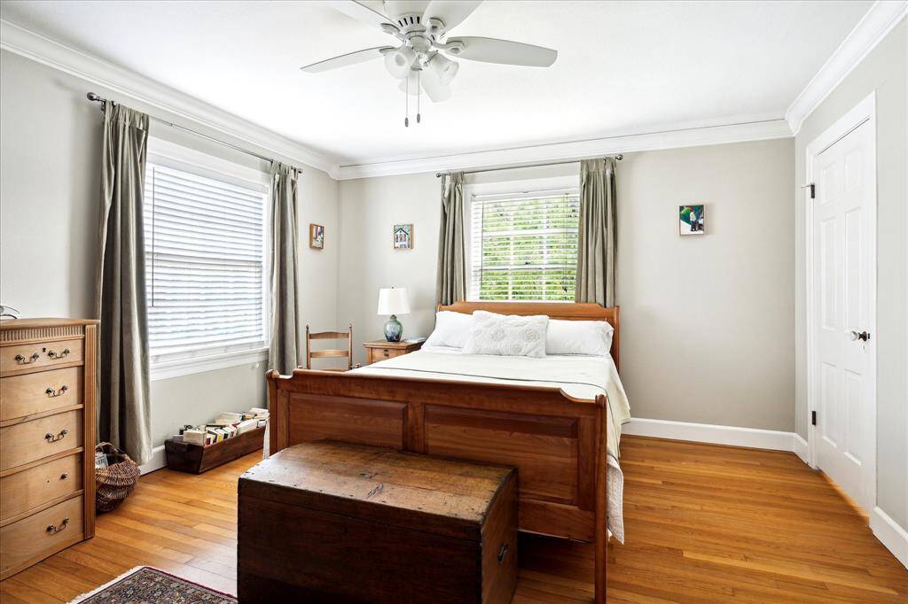 There is a two-car carport and a good size storage room.  There is also an airconditioned bonus room with double French doors overlooking the backyard gardens.