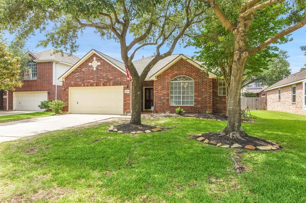 Charming brick home with a well-maintained front yard and mature trees. Features a two-car garage and a welcoming facade. Ideal for a cozy family residence.