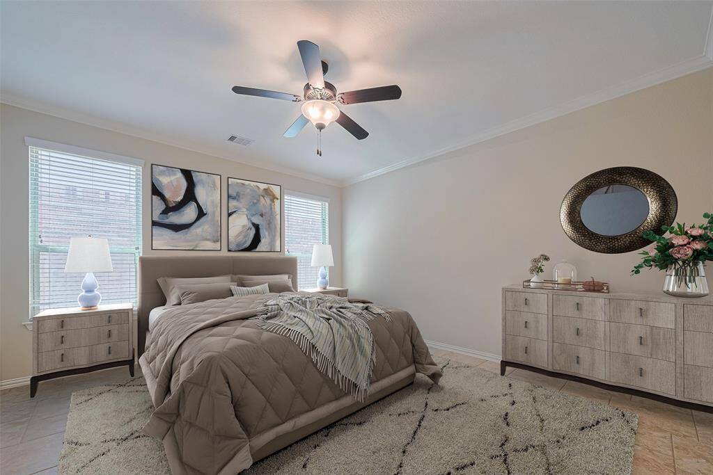 Virtually staged to perfection, this room shows off its generous footprint—easily accommodating a large bed and more.