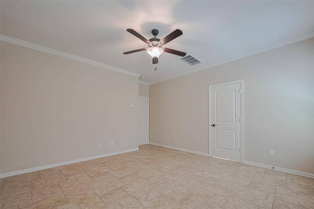 This view shows the room’s thoughtful layout, with a recessed door area that adds more privacy.