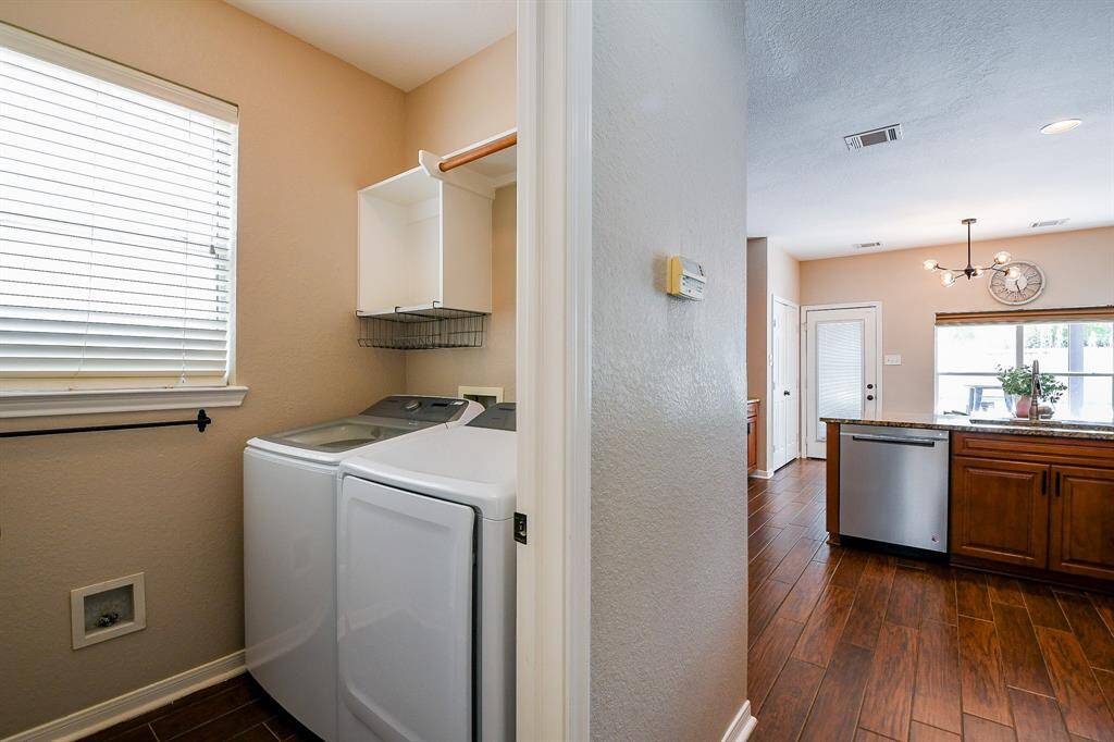 The laundry area is thoughtfully tucked into a cozy, convenient space, making everyday chores easy and accessible without intruding on the main living areas.