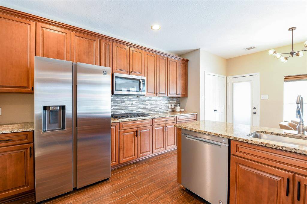 The kitchen offers a Massive amount of Cabinet Storage, providing Ample Room to keep everything organized — from Cookware to Pantry items.