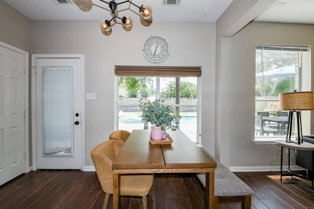 Enjoy your morning meals while gazing out at the stunning backyard paradise.