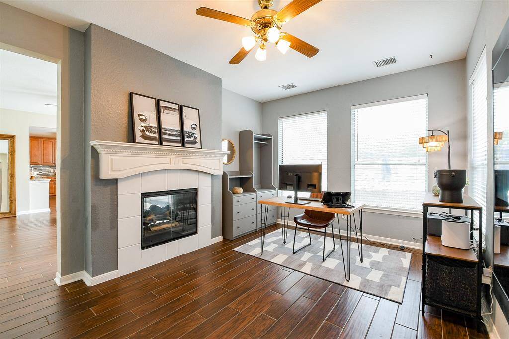 Enhance your work-from-home experience in a Beautifully Designed Home Office featuring its own Cozy Fireplace.