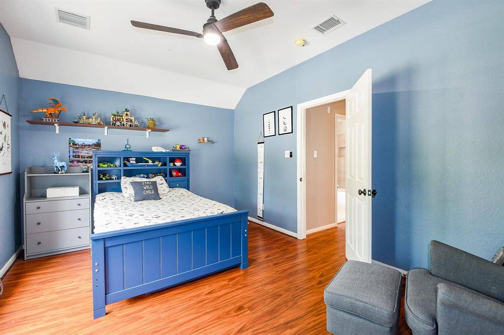Experience the luxury of space in the oversized primary bedroom, offering abundant room for a king-sized bed, seating area, and additional furnishings.