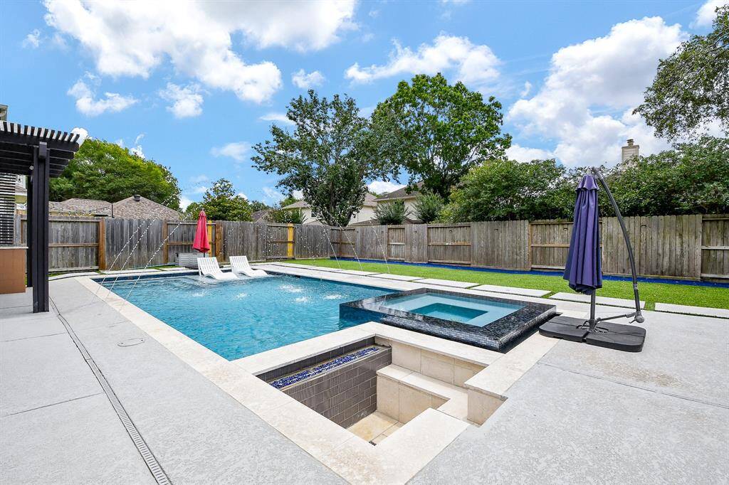 Featuring lush astro turf and large pave stones, the space offers a clean, modern aesthetic that's perfect for relaxing, entertaining, or play—no mowing or muddy patches required.