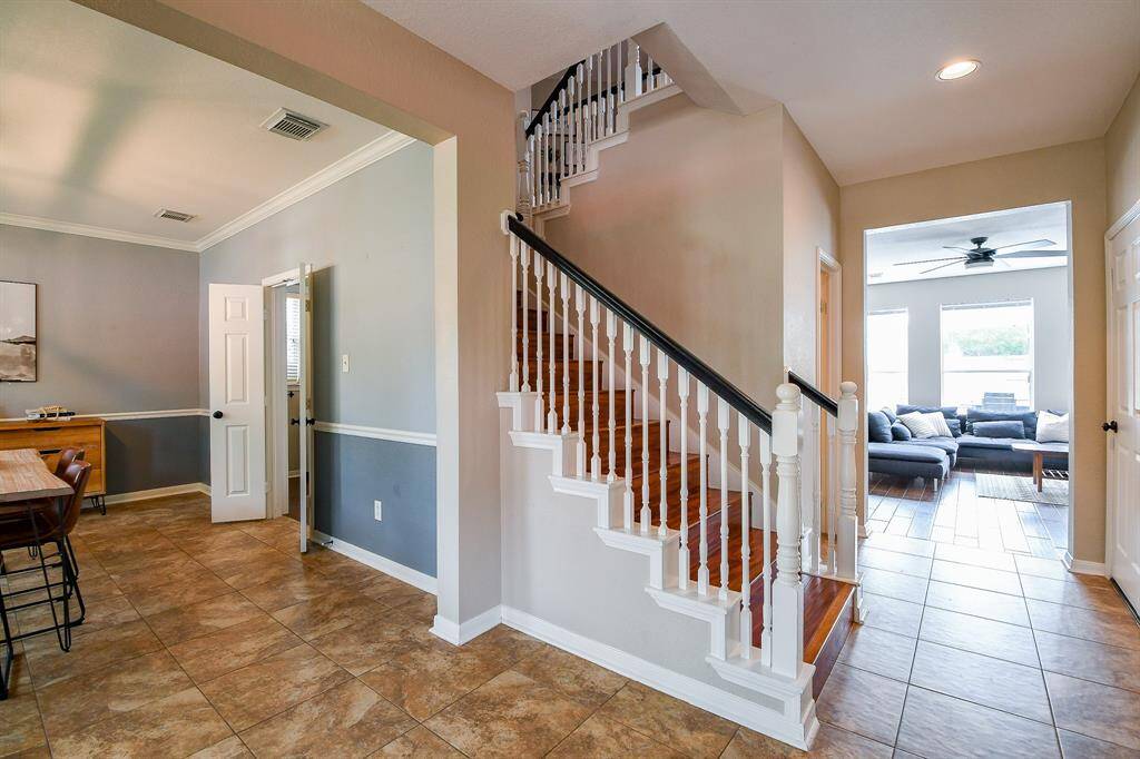 Seamless flow and easy access to the Formal Dining area, Kitchen, Family room, and Upstairs Living Spaces.