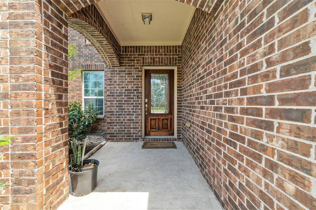 The covering porch creates a welcome yet privacy vibe for the house.