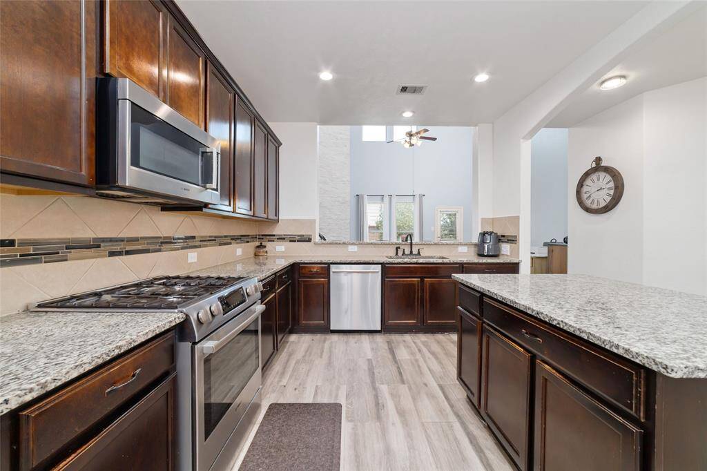 Kitchen is over look to the living area creates a great flow for the house.
