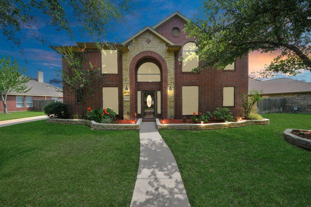Welcome to this magnificent property! At twilight, the striking exterior of this home radiates with charm, evoking the grandeur of a stately castle with its graceful curved walls and turret-inspired architecture.