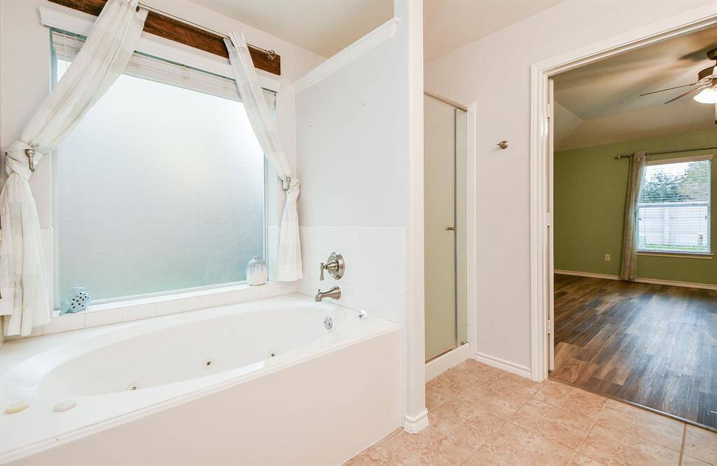 Indulge in relaxation with the luxurious jetted tub.