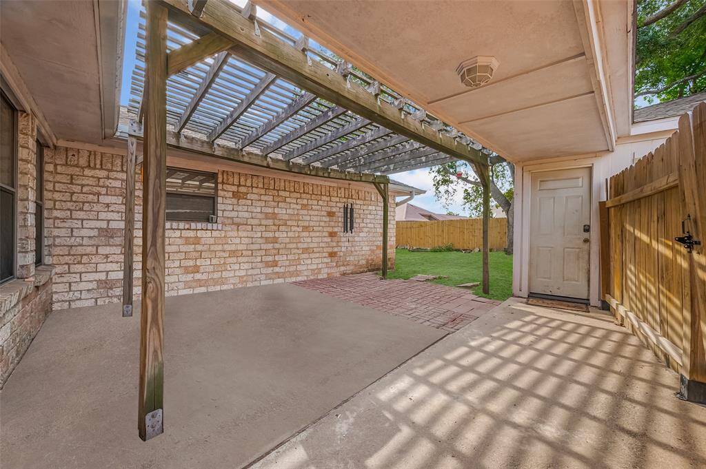 Relax under the custom pergola in this shaded outdoor space—ideal for al fresco dining or quiet evenings under the stars.