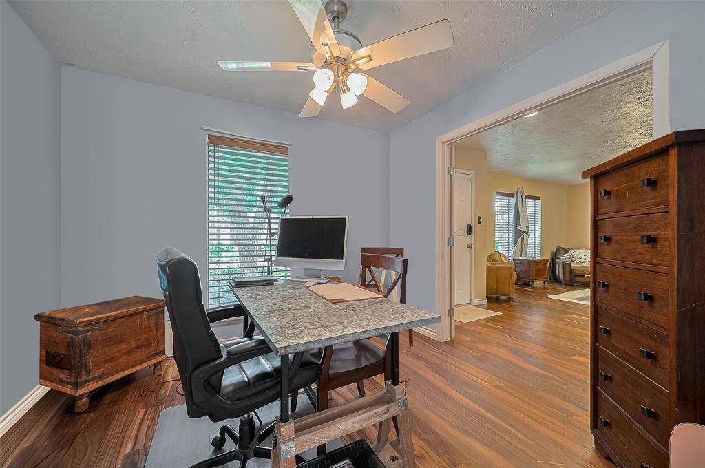 Bright and versatile front room perfect for a productive home office, creative studio, or cozy reading nook—complete with street-facing window for natural light.
