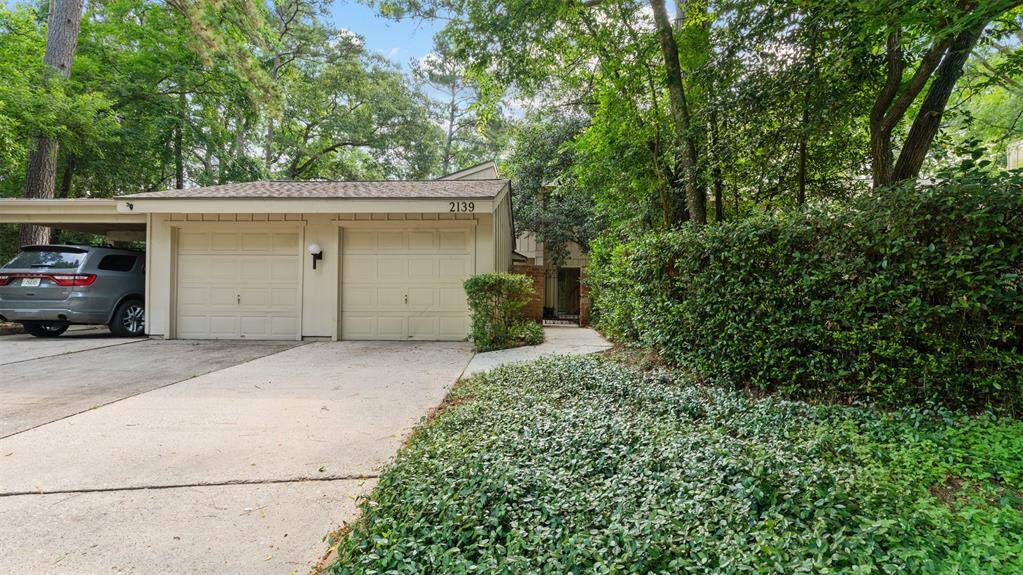 Private Walkway leads to courtyard entry. One car detached garage