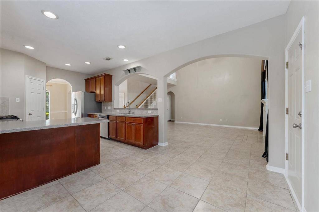 Breakfast area open to the Family Room and backyard access through the door on the right.